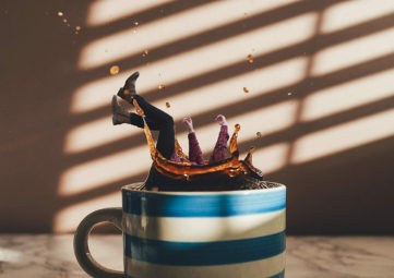 woman falls into cup of coffee