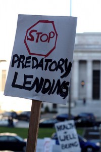 sign calling for the state Legislature to "Stop Predatory Lending"