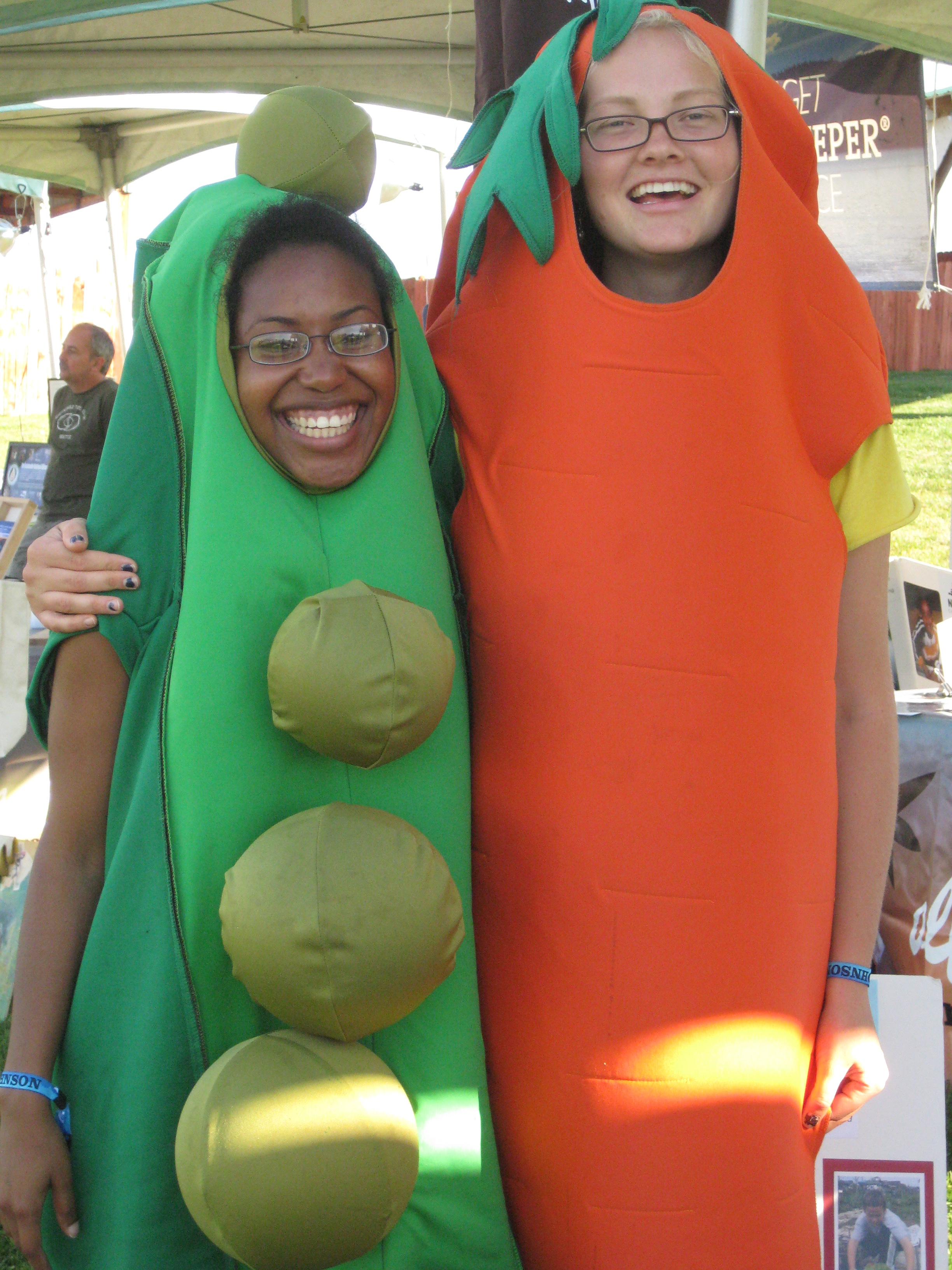 Meredith and Amelia wearing pea and carrot costumes!