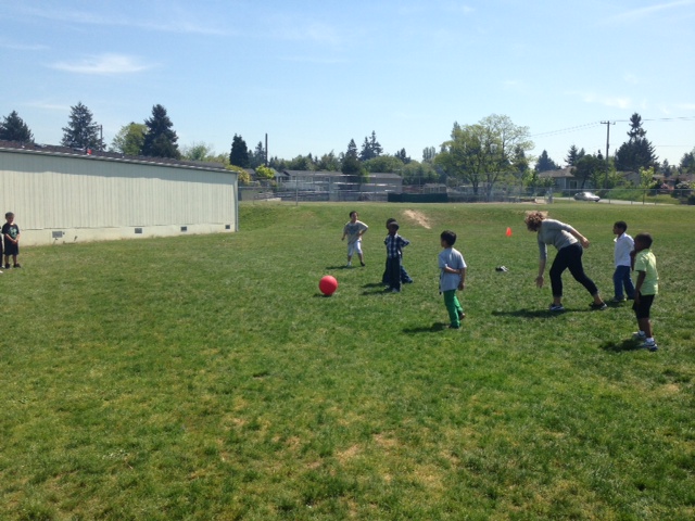 Ms. Eileen playing ball with her students on a beautiful Seattle day!
