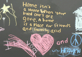Chalkboard art by Sand Point Housing resident children