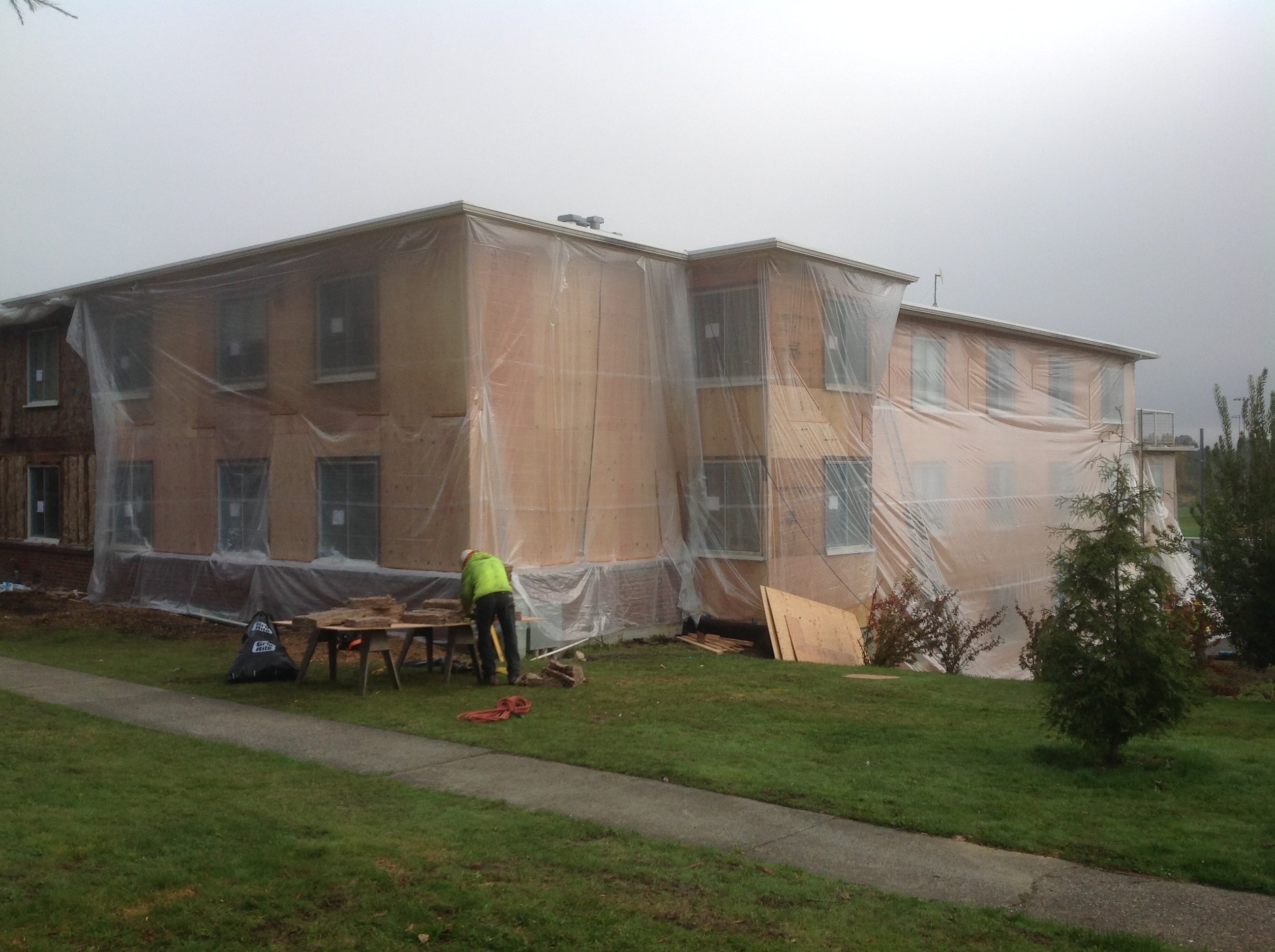 South side of Santos Place with protective plastic wrap