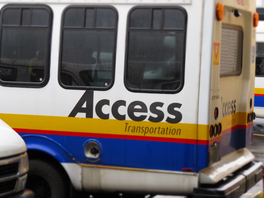 Photo of ACCESS Transportation vans in a parking lot.