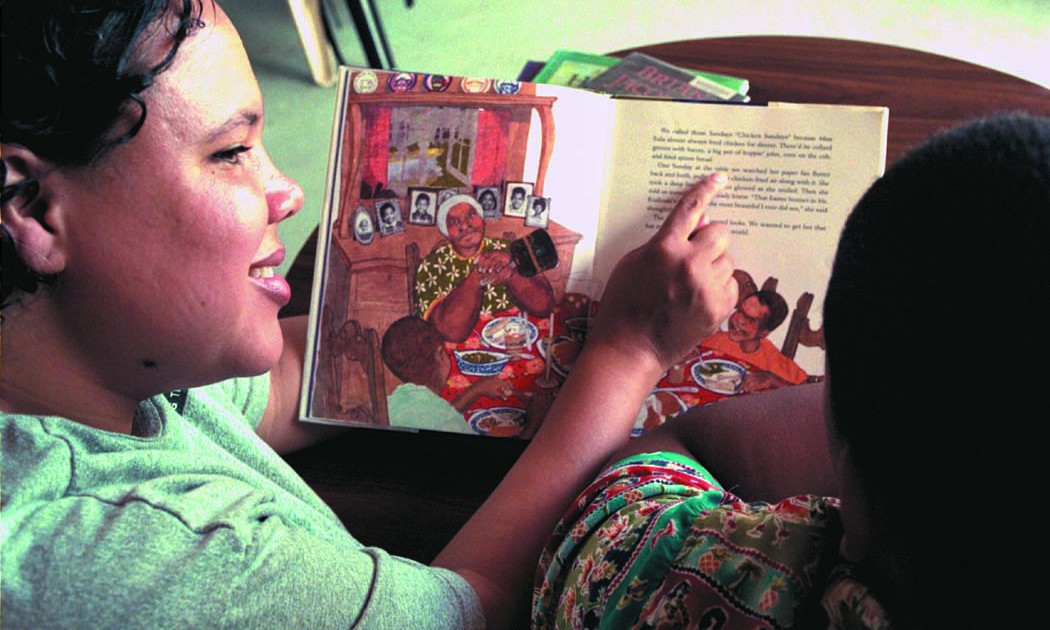 Washington Reading Corps member reads to a child (photo by Jennifer Loomis)