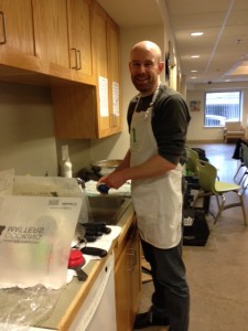 Ross assists with class dishes.