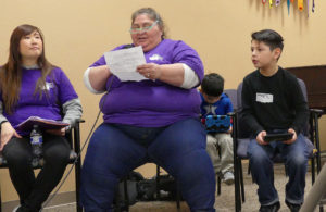 Anthony side-by-side his Nana and little brother during a lobbying role play exercise. (photo by Marissa Fortier)
