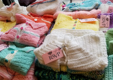 Sweaters and other knit garments ready for donation
