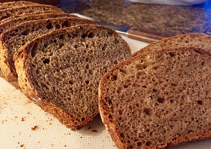 Sliced loaf of brown bread