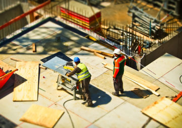 Aerial view of two construction workers on a job site