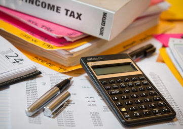 Income tax prep materials (book, pen, calculator, etc.)