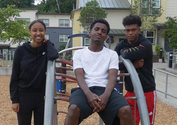 (L to r): Mekedes, Semere, and Bereket: Three Sand Point Housing Class of 2019 high school graduates who are all headed to college in the fall (photo by Liz Reed Hawk).