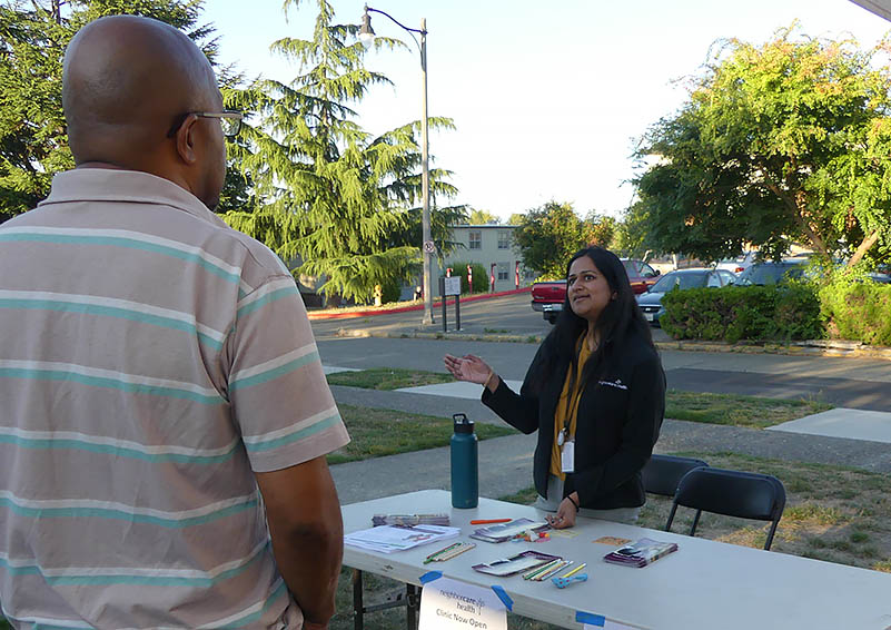 An attendee learns what Neighborcare Health has to offer.