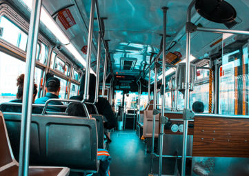 interior of a public bus with a blue tint