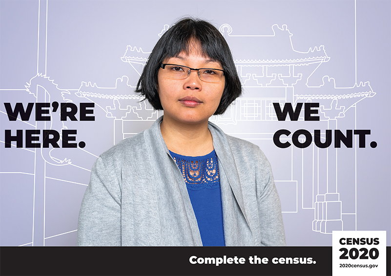 US Census poster picturing a woman w/ the text: "We're here, we count."