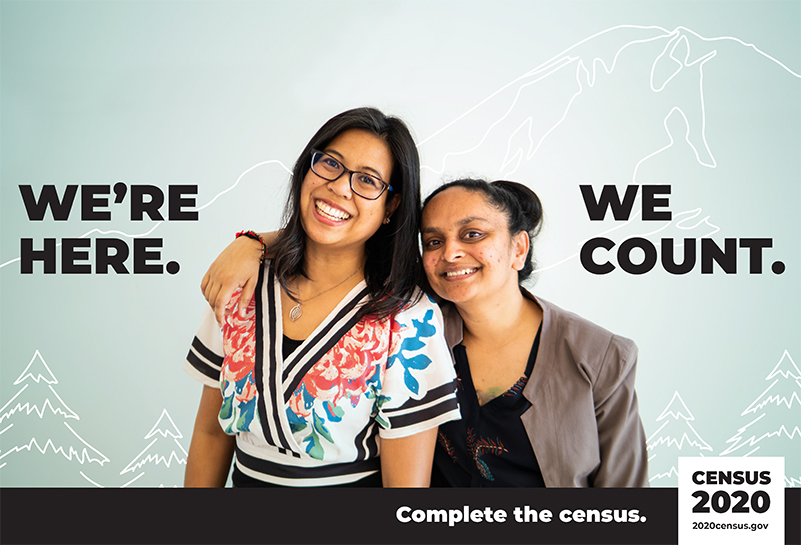 US Census poster picturing two women w/ the text: "We're here, we count."