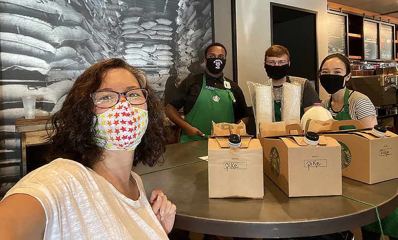 Ellen with Starbucks employees