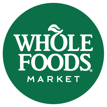 WHOLE FOODS MARKET logo in a kale green circle with white lettering