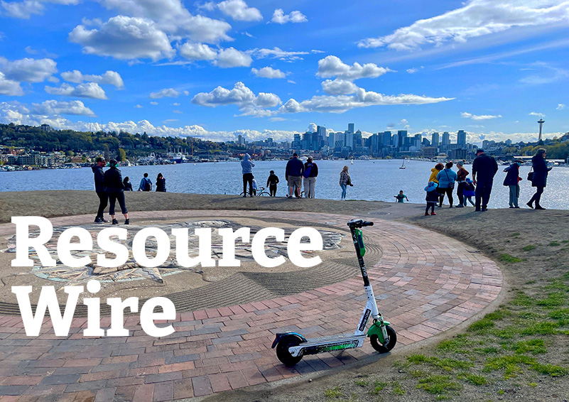 The words "Resource Wire" embossed over a view of the Seattle down skyline and Lake Union from atop a hill in Gasworks Park