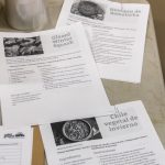 Sheets of paper with various recipes in English and Spanish