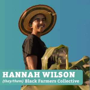 Smiling person standing in a cornfield wearing a straw hat and black T-shirt with the label HANNAH WILSON (they/them) Black Farmers Collective