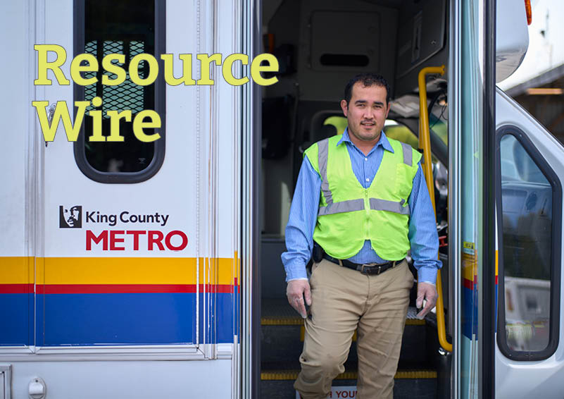 A man in a neon-yellow vest steps out of the doors of a para-transit van that says "King County Metro" on the side. The words "Resource Wire" appear in the corner of the picture.
