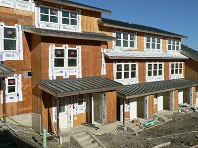A construction site for a row of townhomes.