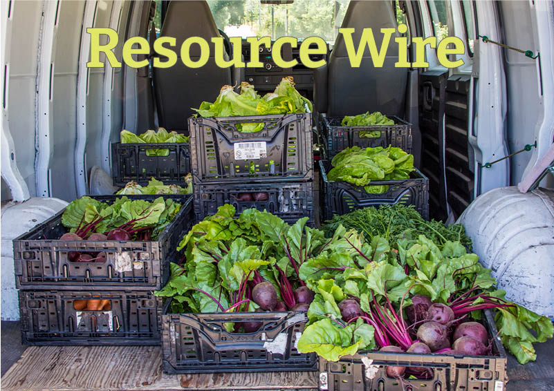 Several black cartons full of freshly-harvested beets and greens stacked in the back of a white van. The words "Resource Wire" appear at the top of the image.