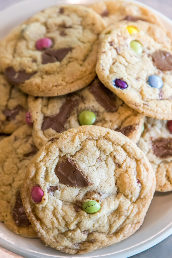 A plate of MnM-chocolate chunk drop cookies