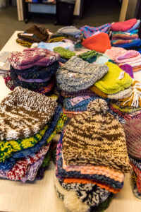 Stacks of colorful knitted items