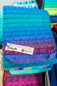 Stacks of knitted scarves