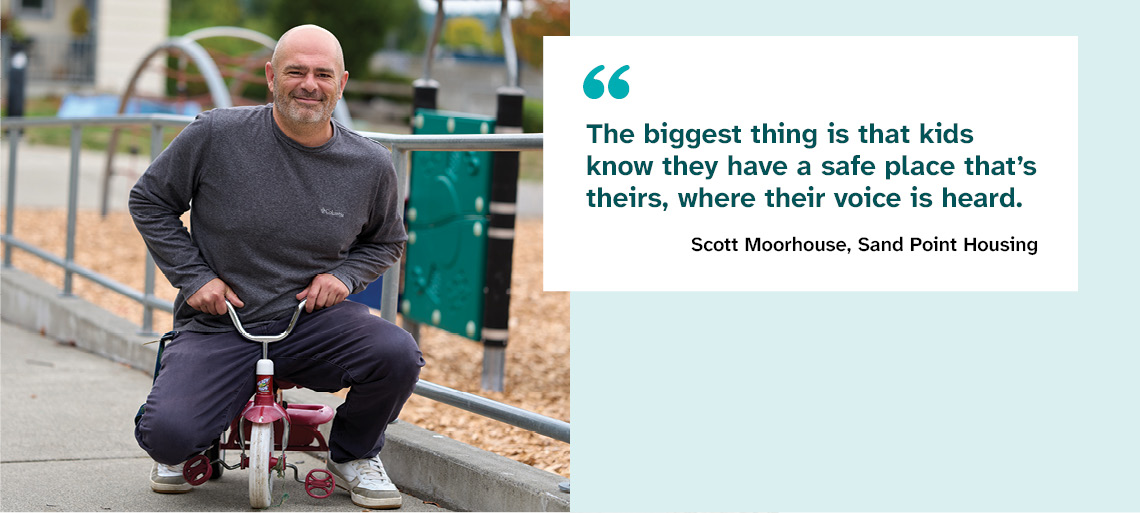 A balding man with grey facial hair sits on a tiny red tricycle and smiles. To his right is the quote,