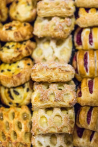 Rows of pastries of various kinds
