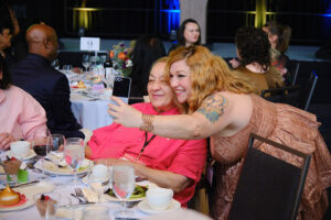 Two women leaning in to take a selfie