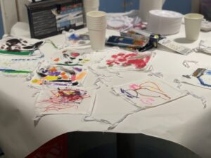 Paint and art supplies scattered across a table
